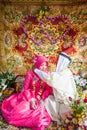 Islamic Wedding, groom putting a gold necklace on bride. Tradition and culture of Thai Muslim. Bride wearing head scarf hijab